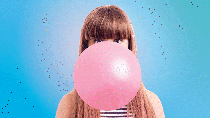 Loop of a woman blowing up a bubble of chewing gum and letting it shrink again. Loop of a woman blowing up a bubble of chewing gum and letting it shrink again.