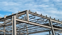 The steel frame of a new office building under construction.Similar Images.