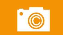 Illustration of a camera with a icon of picture credits in the middle.