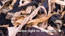 Close-up of a large pile of waste textile pieces in various colors, tangled together. Close-up of a large pile of waste textile pieces in various colors, tangled together.
