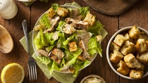 Healthy Grilled Chicken Caesar Salad with Cheese and Croutons_Shutterstock 246281896