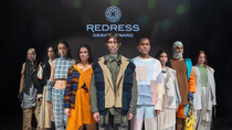 A line-up of models in front of the redress logo. A line-up of models in front of the redress logo.