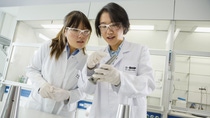 Lili Zhang (left), lab chemist, checks polymer pellets for extrusion experiments with Siqi Xue (right), lab manager. BASF is one of the world’s leading producers of high-quality plastics. Research teams across the globe are systematically developing the properties of plastics to open up diverse applications in automotive, electrical & electronics and packaging industries. Lili Zhang (left), lab chemist, checks polymer pellets for extrusion experiments with Siqi Xue (right), lab manager. BASF is one of the world’s leading producers of high-quality plastics. Research teams across the globe are systematically developing the properties of plastics to open up diverse applications in automotive, electrical & electronics and packaging industries.
