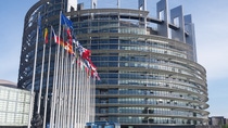 View of the European parliament with many country flags 