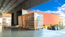 Freight transportation by trucks, trucks trailer docking loading cargo at warehouse Freight transportation by trucks, trucks trailer docking loading cargo at warehouse