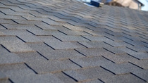Bitumen tile roof. Roof Shingles - Roofing. Close up view on Asphalt Roofing Shingles . Bitumen tile roof. Roof Shingles - Roofing. Close up view on Asphalt Roofing Shingles .