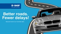 A silver car driving on a road against blue background. The text reads: "Better roads, Fewer delays!"