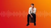 Person sitting on a stool. The background shows a stylized sound‑wave graphic on an orange gradient