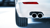 Close up shot of a white car exhaust Close up shot of a white car exhaust