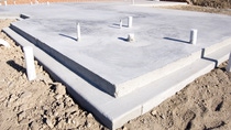 Picture of a concrete slab for a house.  Taken during the early morning.