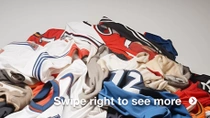 A pile of used sports jerseys in various colors. A pile of used sports jerseys in various colors.