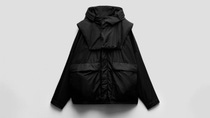 Black anorak on a light background.