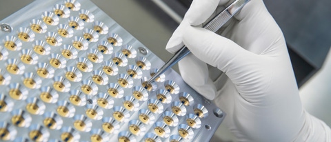 BASF’s start-up, trinamiX, develops and produces miniaturized infrared sensors named Hertzstück™. The sensors can be used for various applications such as gas sensing, flame control or near-infrared-spectroscopy. Thanks to their small footprint and high availability, they are also applicable to consumer applications. The sensors are offered in various pack-agings. The photo shows how the sensors are prepared for further processing. As the sensors are sensitive to dust they are processed in the cleanroom of trinamiX. 