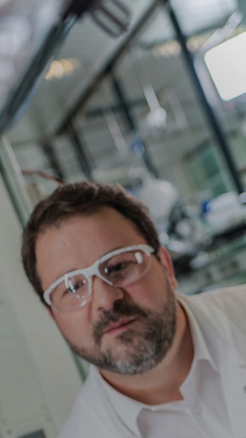 Scientists examine a sample. Scientists examine a sample.