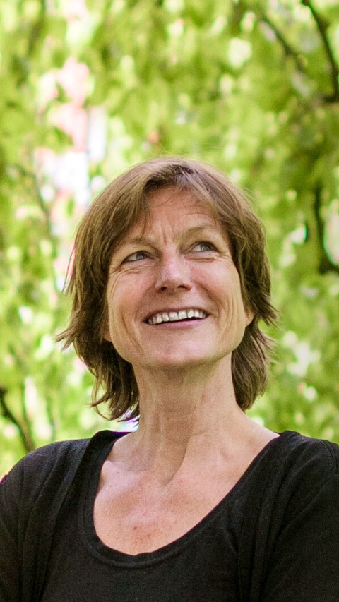 Portrait of Linda Steg with hanging tree branches in the background- Portrait of Linda Steg with hanging tree branches in the background-