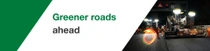 A road construction at night with workers and machinery. A light swirl hovers over the scene. The text reads: "Greener roads ahead." A road construction at night with workers and machinery. A light swirl hovers over the scene. The text reads: "Greener roads ahead."