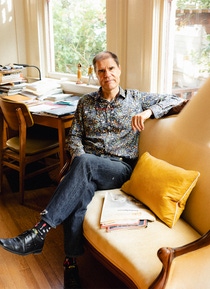 Mathis Wackernagel sitting on a sofa in his Oakland home. Mathis Wackernagel sitting on a sofa in his Oakland home.