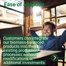 Person seated in a modern office leaning back with arms resting behind the head, with a desk in the foreground. Person seated in a modern office leaning back with arms resting behind the head, with a desk in the foreground.