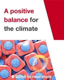 Red and blue dishwasher tablets. A light swirl hovers over the tablets. The text on the image reads: "A positive balance for the climate."