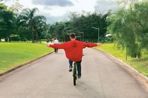 Boy rides a bicycle hands-free Boy rides a bicycle hands-free