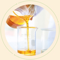 Glass jug filled with oil, pour the contents into a measuring cup. Glass jug filled with oil, pour the contents into a measuring cup.