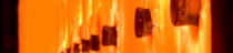 The picture shows the inside of a furnace with burning flames, glowing bright orange as the furnace heats up to 850 degrees Celsius